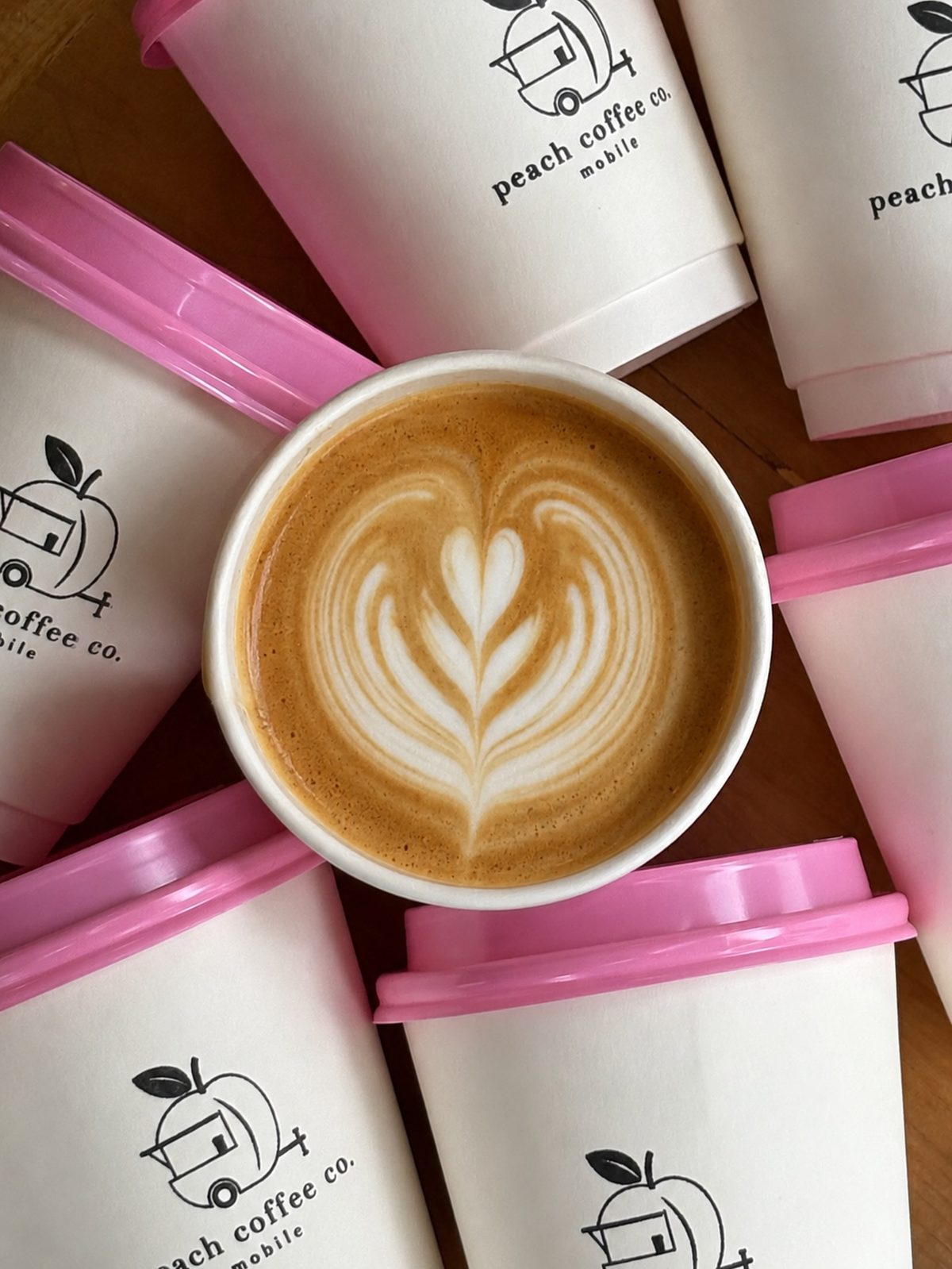 Peach Coffee Co. Mobile branded cups with latte art